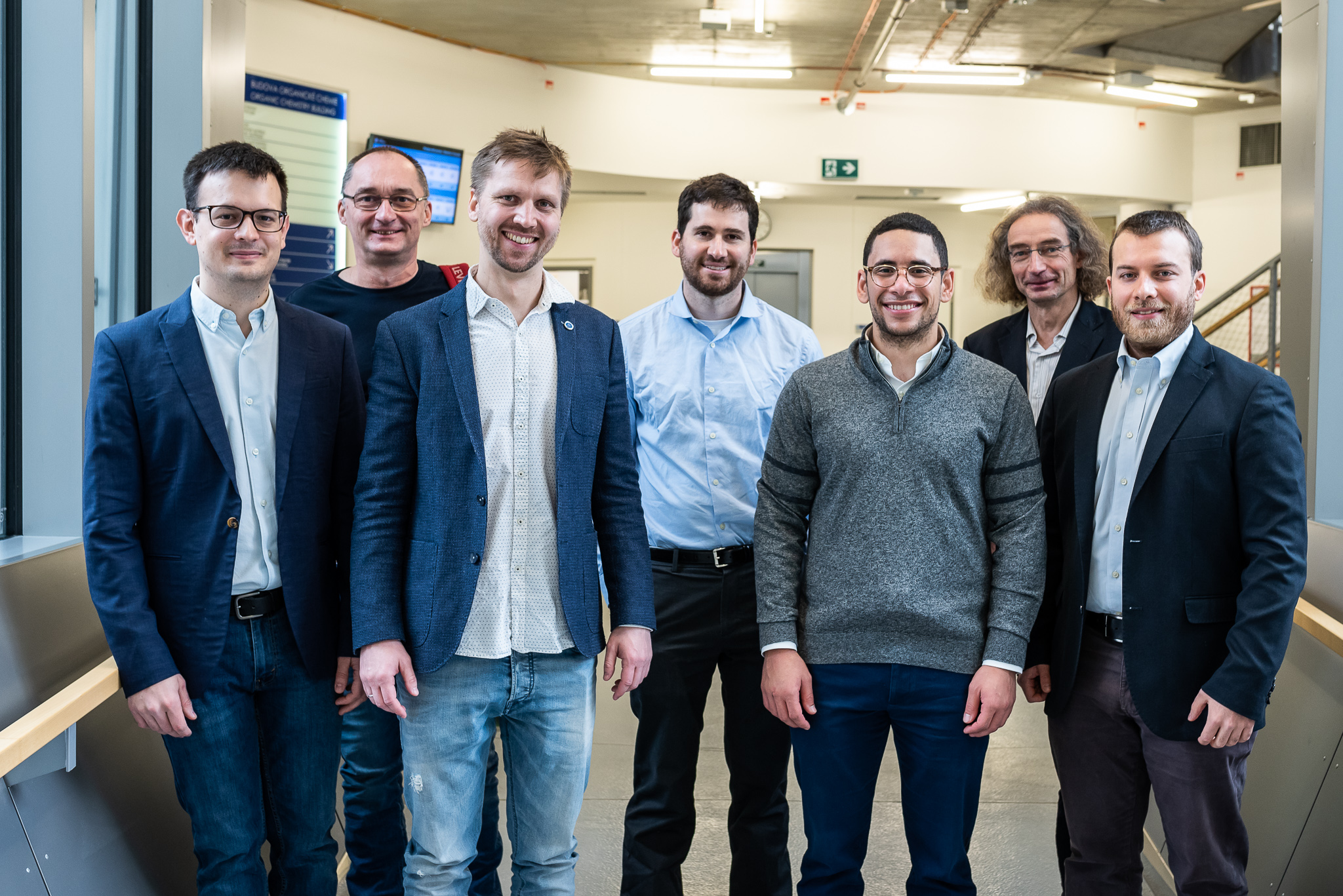 From the left: Luka Đorđević (Northwestern University), Robert Hołyst (IPC PAS), Johannes Bintinger (Linköping University), Jarad Mason (Harvard University), Ahmed Badran (Scripps Research), Pavel Jungwirth (IOCB Prague), Giulio Ragazzon (ISIS, University of Strasbourg) (Photo: Tomáš Belloň / IOCB Prague)